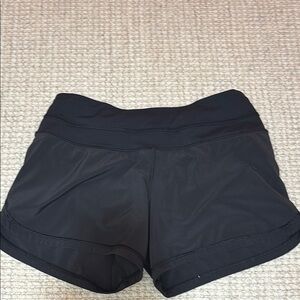 Women’s black, high rise Lululemon black athletic shorts. In amazing condition